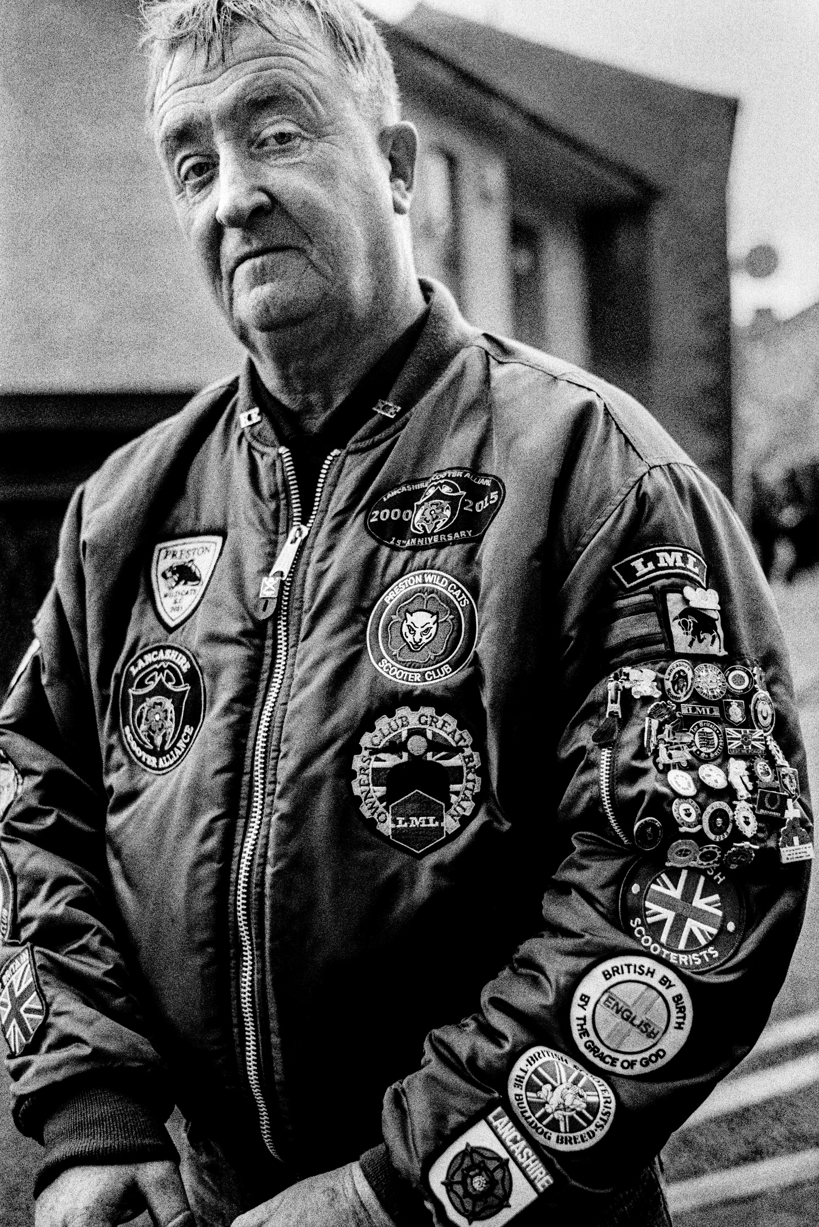 A Scooter Enthusiast at the Ribble Valley Mod Weekender, Clitheroe, September 2016. Photographed by Matthew Fleming on 35mm Ilford HP5 film with a Leica M6.