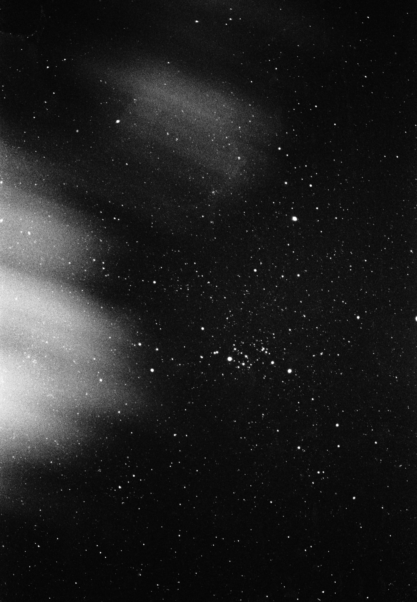 Clouds are blown across a starry night sky in Clitheroe, Lancashire, 2016. Photographed by Matthew Fleming on 35mm Ilford HP5 film, with a Nikon F100.