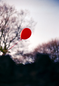 A red balloon, in the style of Stephen King's IT as photographed in Clitheroe one October. 
By Matthew Fleming with a Leica M6 and Agfa Vista 200 ('Poundland') film. 