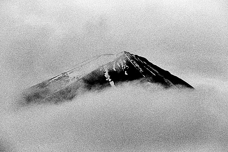 The view of Mt. Fuji, shrouded in cloud, from Fujikawaguchiko.
From the photographic series "In Praise of Shadows". Shot on black and white film by photographer Matthew Fleming. 
