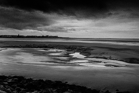 Photograph from the series To Live and Die in Lancashire: The Chapel of the Roses by Matthew James Fleming. Taken with a Leica M6 and Ilford HP5 35mm film. 
Morecambe flats looking South viewed in the morning at low tide.