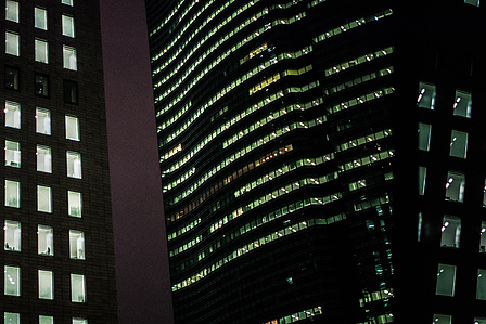 Office buildings at night, Tokyo. 
Photograph from the series Forbidden Colours by Matthew James Fleming. Taken with a Leica M6 and Kodak Portra 400 35mm film.