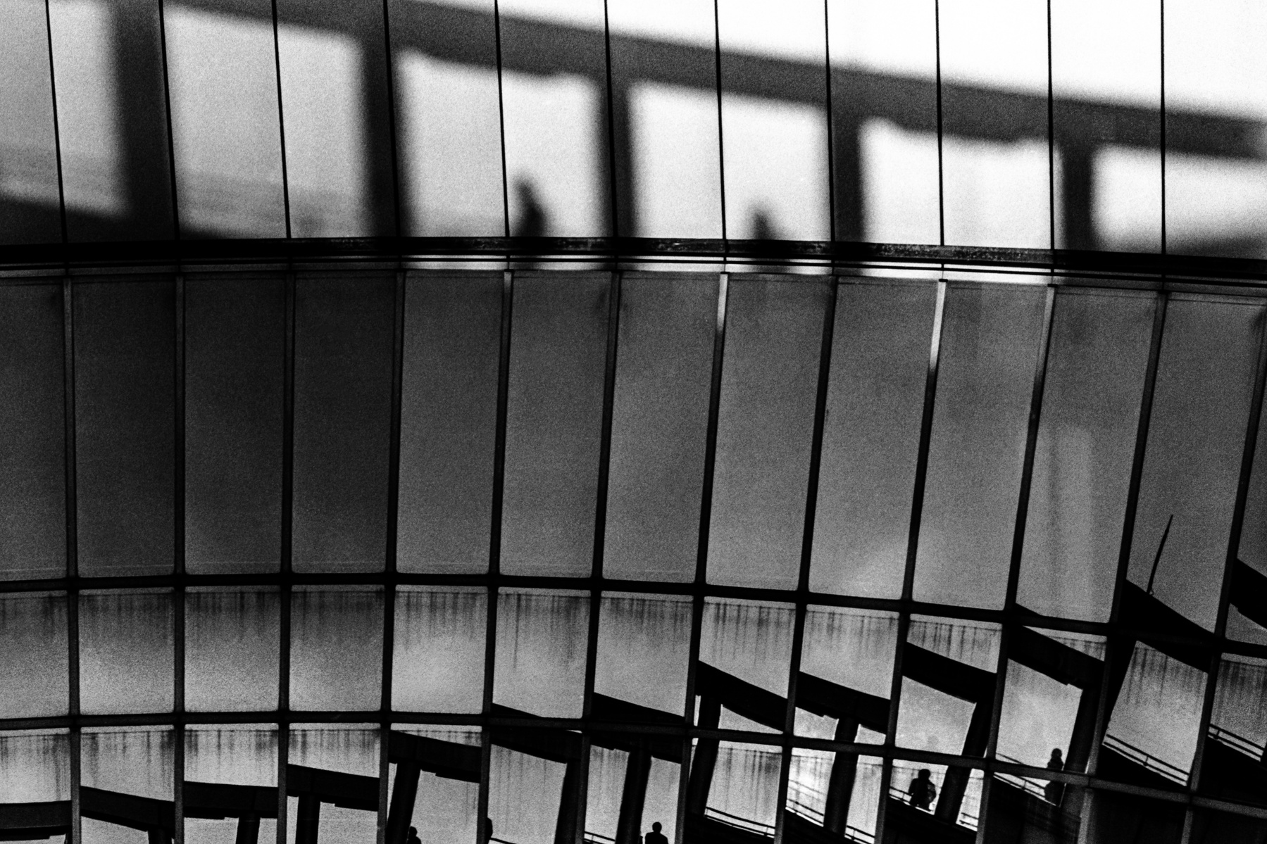 Reflections and shadows in Osaka, November 2014. Photographed by Matthew Fleming on 35mm Ilford HP5 film with a Leica M6.