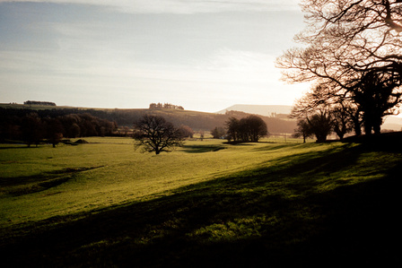 The winter sun hangs low over Pendle Hill, Lancashire one January morning. Photograph by Matthew James Fleming. Taken with Ricoh GR1v and Kodak Portra 400 35mm film. Clitheroe, Ribble Valley.