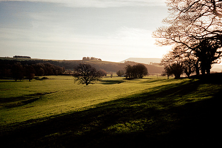 The winter sun hangs low over Pendle Hill, Lancashire one January morning. Photograph by Matthew James Fleming. Taken with Ricoh GR1v and Kodak Portra 400 35mm film. Clitheroe, Ribble Valley.