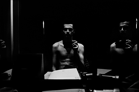 The photographer, jet-lagged, shortly before dawn. 
From the photographic series "In Praise of Shadows". Shot on black and white film by photographer Matthew Fleming. 