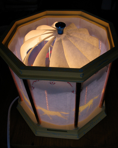 kathleen weldon, lamp, carrousel, magic spinning lamp, spinning lamp, rotating lamp