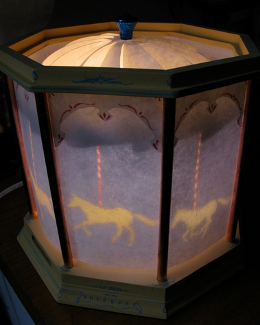 kathleen weldon, lamp, carrousel, magic spinning lamp, spinning lamp, rotating lamp