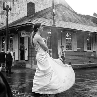 Black and white street photography of the french street photographer David Décamps representing a man with a white dress in New Orleans, USA.