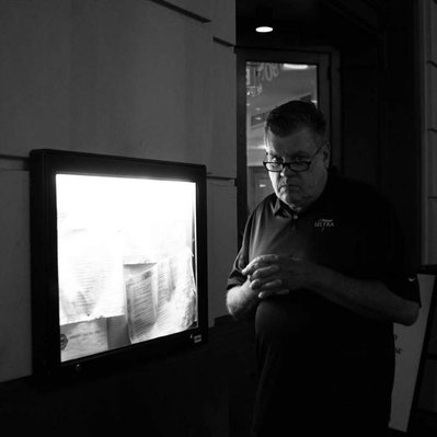 Black and white street photography of the french street photographer David Décamps representing a man with a not very polite face in New Orleans, USA.