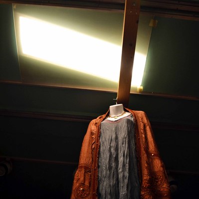 Street photography in colors of the french street photographer David Décamps representing a blue and orange dress in a store in New York City, USA.