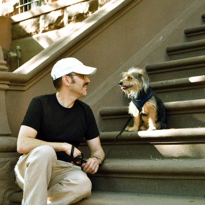 Street photography in colors of the french street photographer David Décamps representing a man looking at his dog in his stair in New York City, USA.