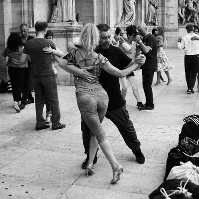 Black and white street photographic serie of David Décamps called Intense Experience representing people dancing tango in front of the Opera in Paris.