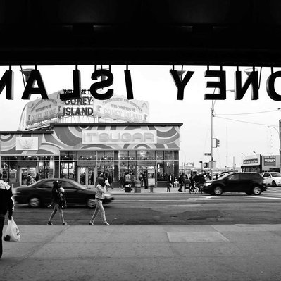 Black and white street photography of the french street photographer David Décamps representing the view from the metro station of Coney Island, in New York City, USA.