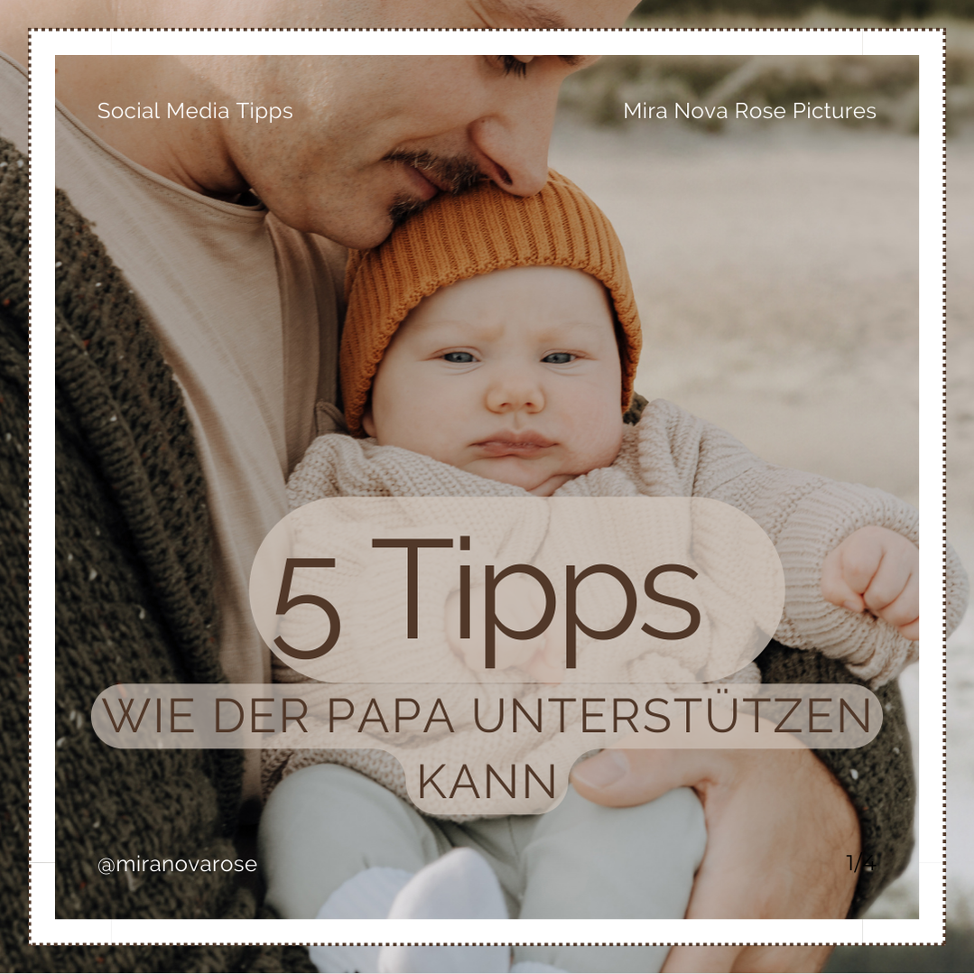 Junger Vater am Strand hält Baby auf dem Arm.