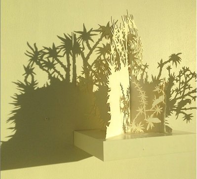 ntersections,  (Gallery window right) Cut paper, beeswax, wood shelf 