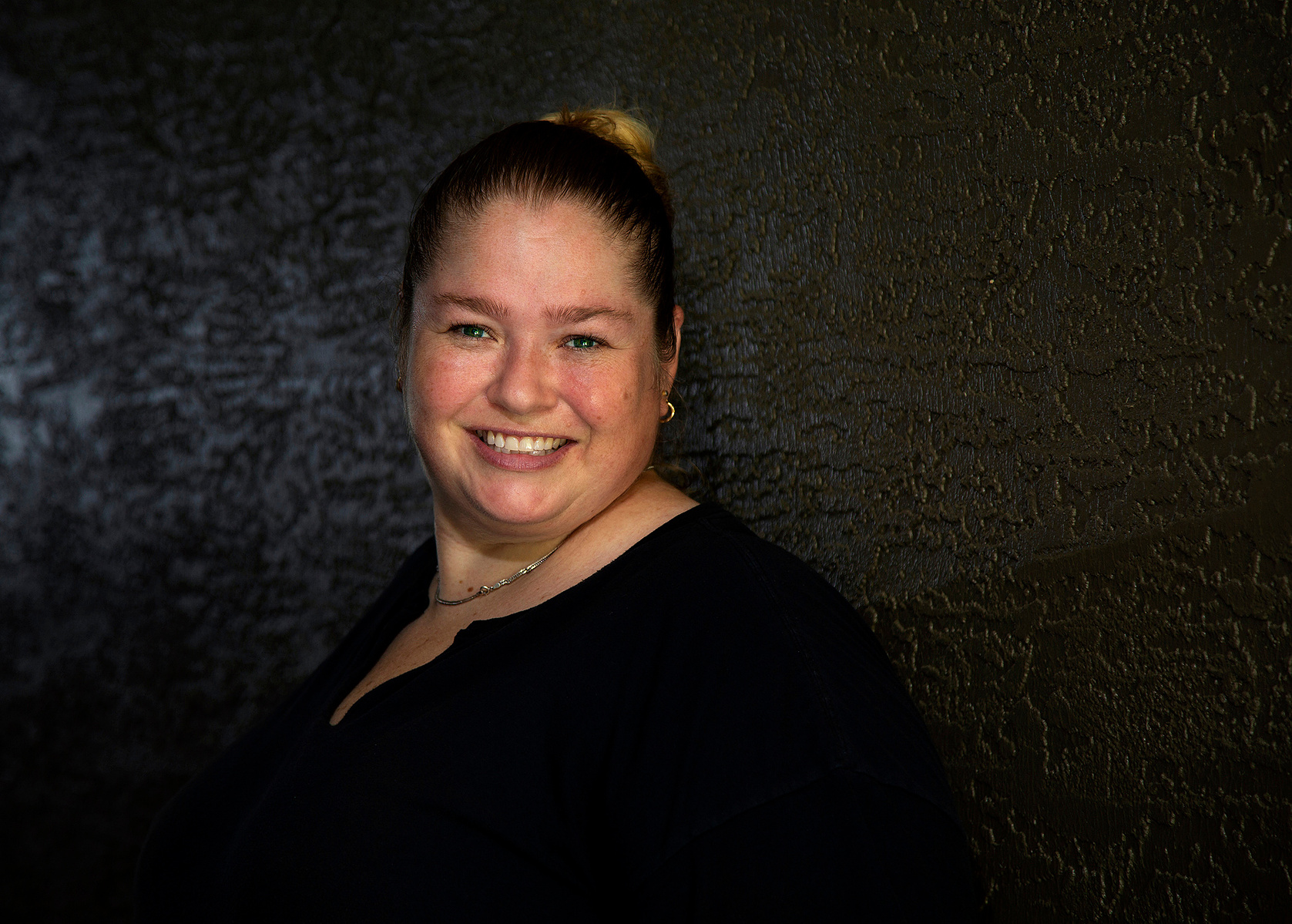 A woman smiles at the camera in Tampa, FL