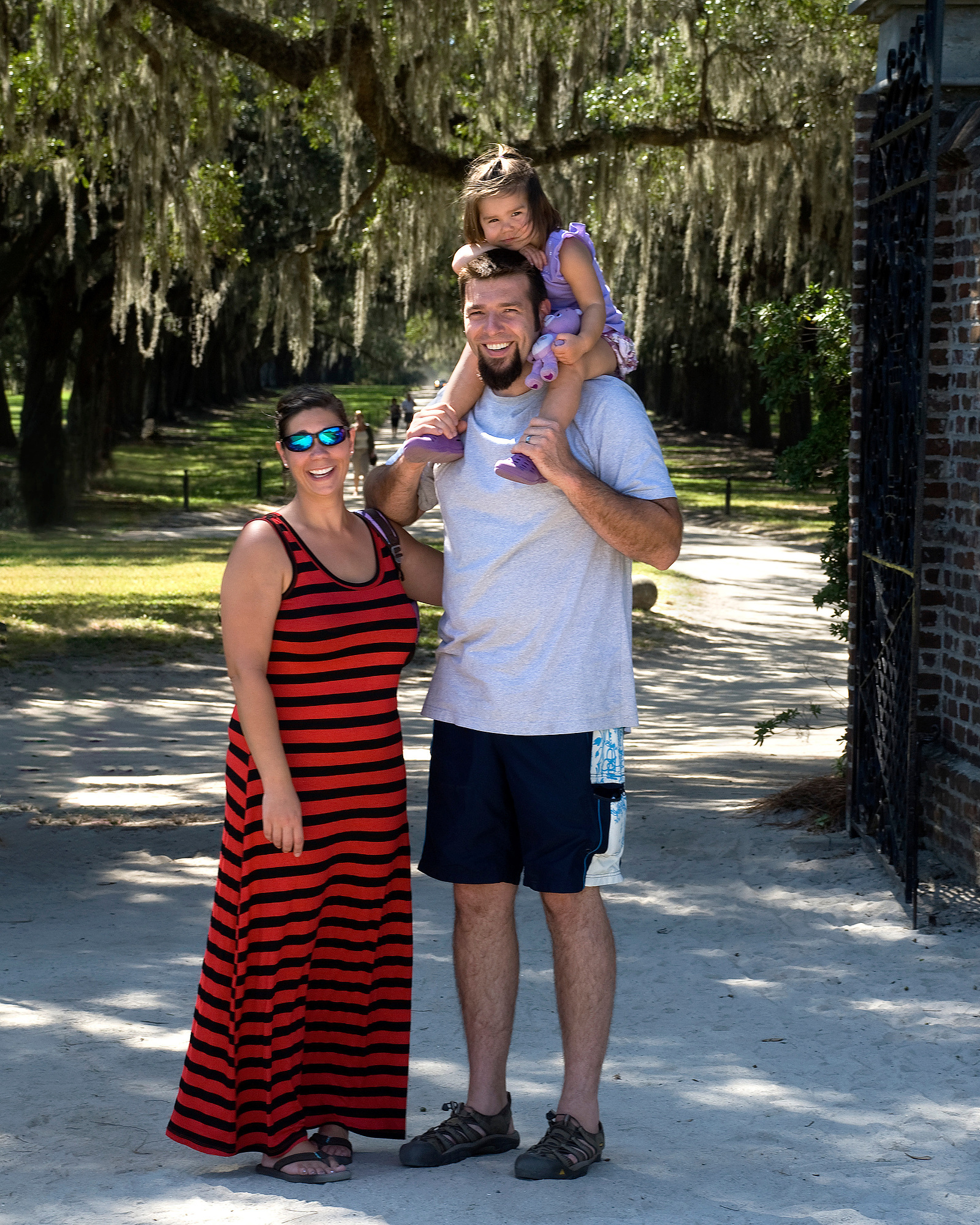 A couple with a young child on vacation in Charleston, SC