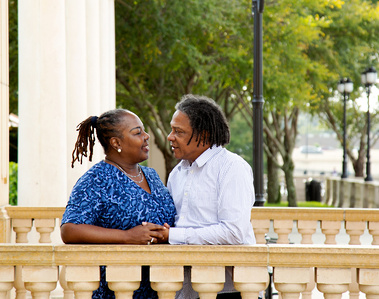 An older married couple stand together in Florida