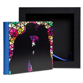 A fine art portrait album with a custom designed cover for a married couple