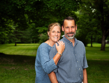 A couple outside in rural Vermont