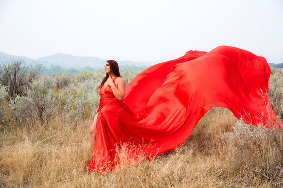 Woman in red dress outdoors in North Dakota by Williamsburg Portrait Photographer Dark Light Portrait Studios