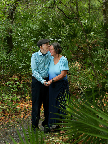 A man kisses his wife outdoors in Florida