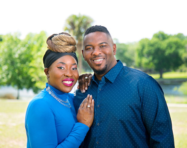 An African-American couple smile at the camera in Tampa, FL