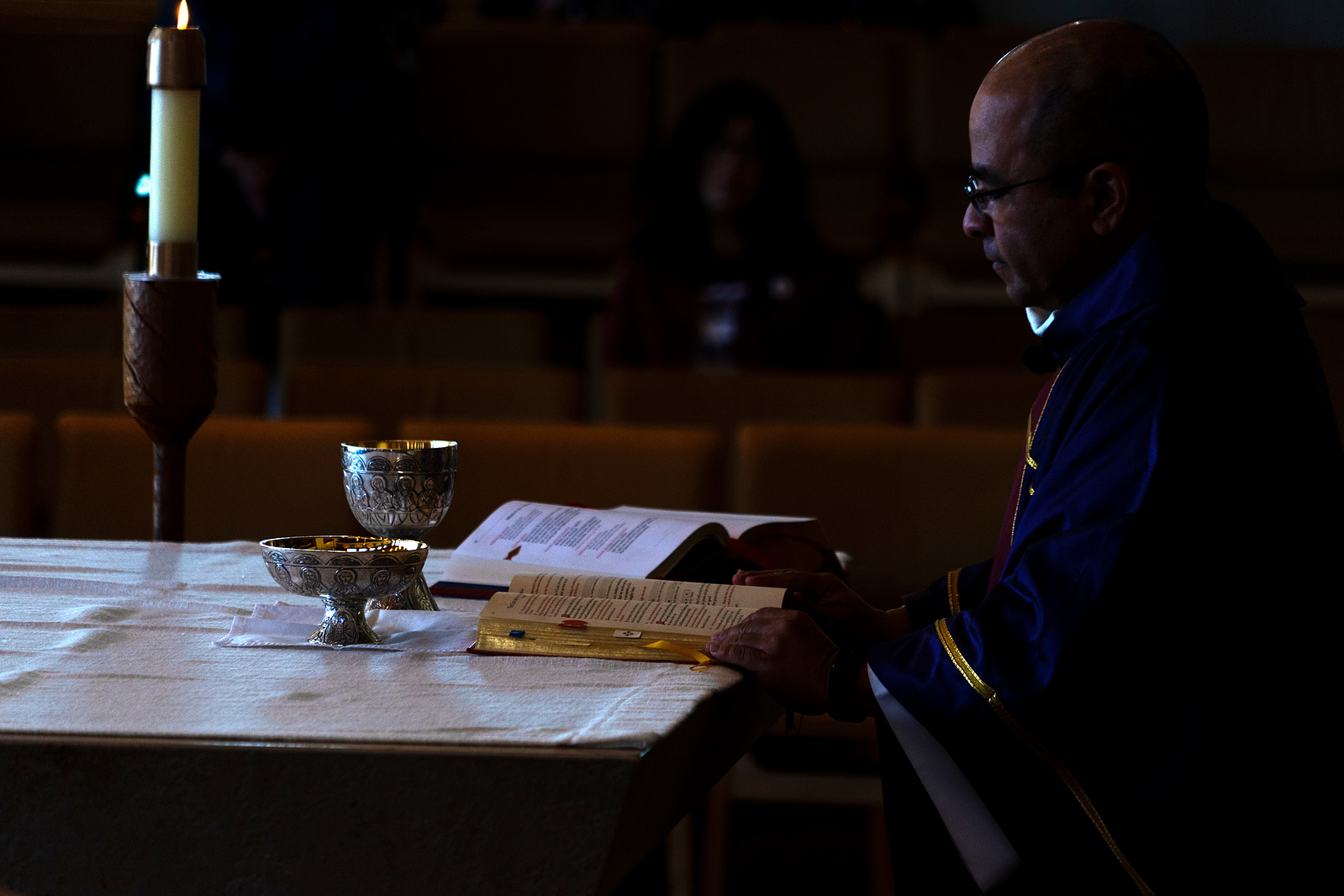 The Rev. Fernando Alvarez-Lara reads from the gospel during a Catholic mass in Denver on Saturday, April 2, 2022. Each year, the traditional Catholic mass precedes the Cesar Chavez Peace and Justice March. Photo by Anthony Albidrez