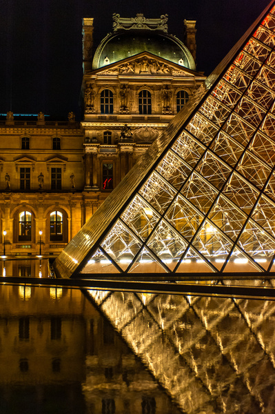 Close up perspective of the pyramid at the Louvre museum in Paris.