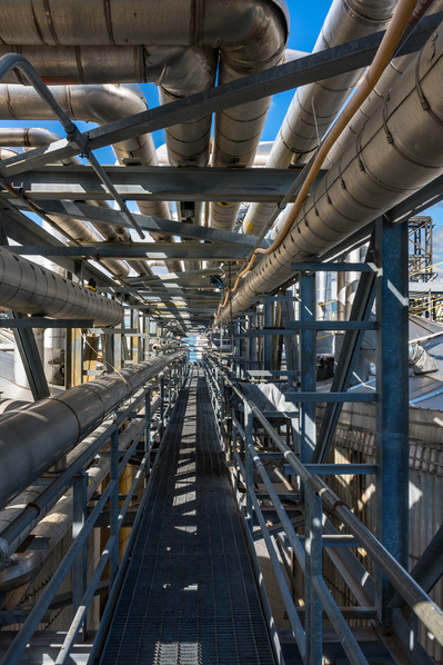 Industrial piping system at a modern chemical processing plant in Chicago, IL as seen by a corporate photographer