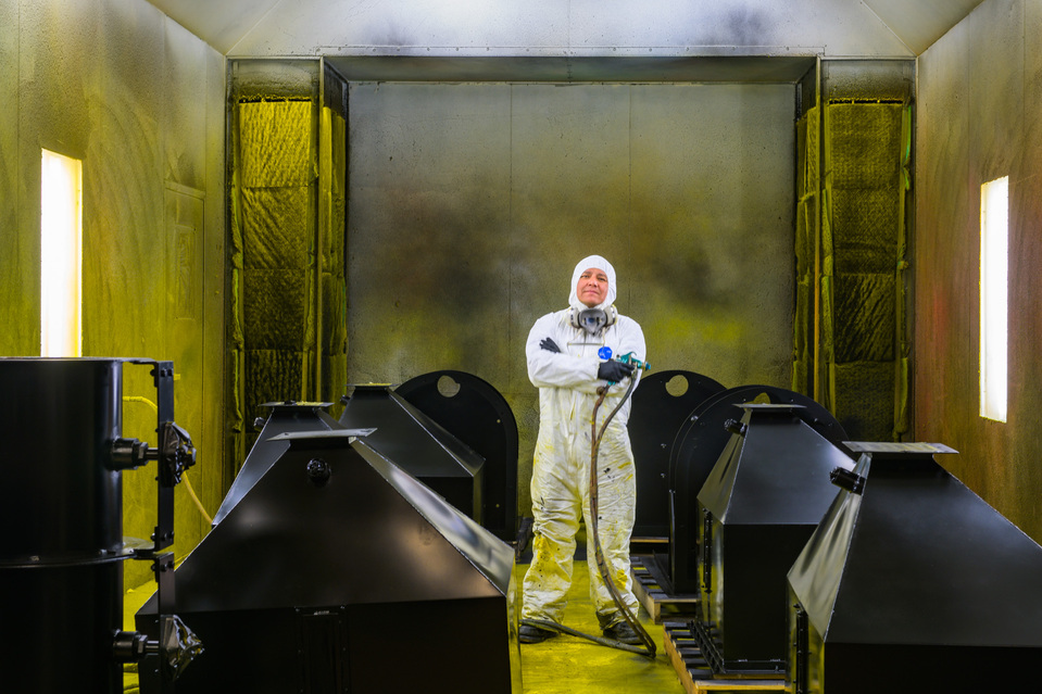 An industrial painter in his industrial paint room