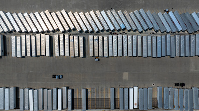 Truck trailers awaiting unloading and loading at a manufacturing and distribution facility