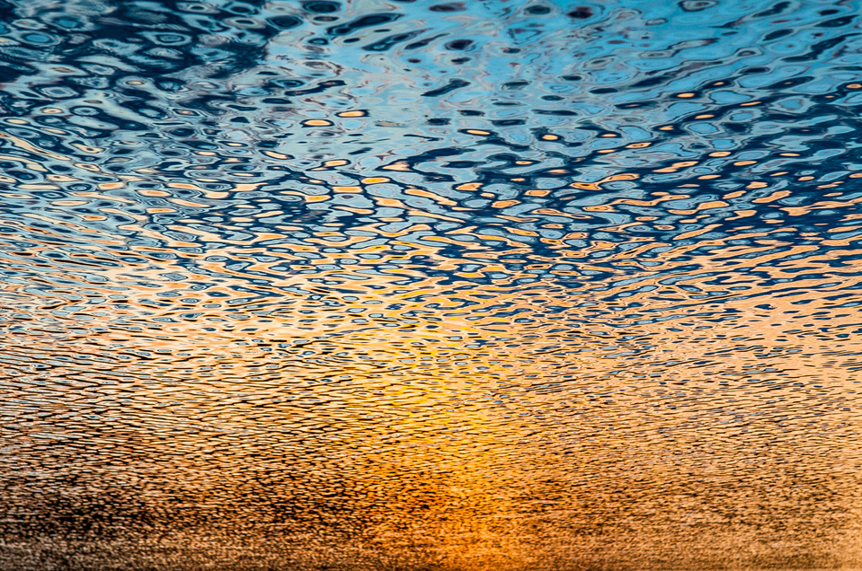 Abstract colorful view of sunset and sky reflected in a lake