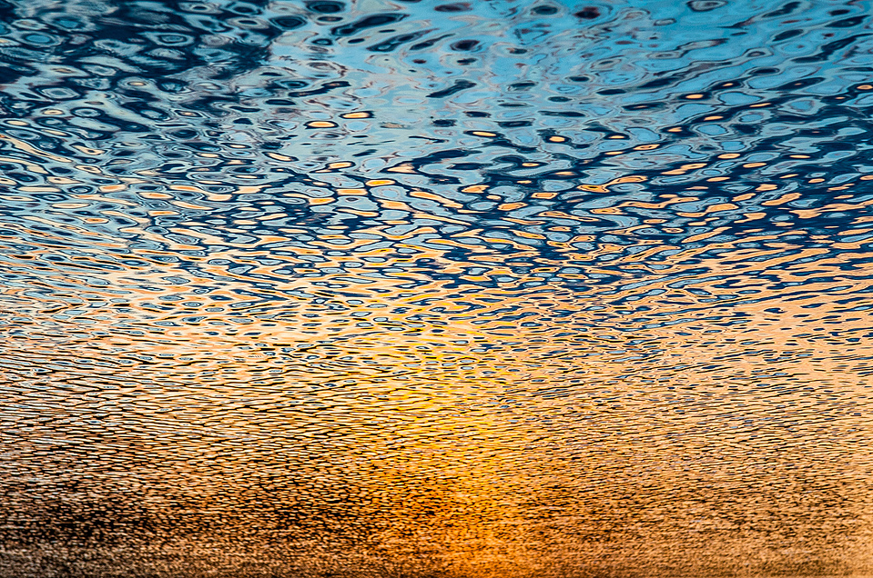 Abstract colorful view of sunset and sky reflected in a lake