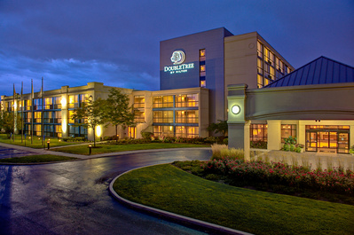 Great example of architectural photography of the exterior DoubleTree by Hilton Hotel in Arlington Heights, IL at dusk. 
