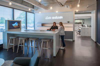 Two designers selecting design elements in corporate lobby at Office Revolution