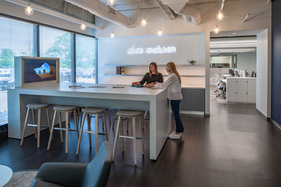 Two designers selecting design elements in corporate lobby at Office Revolution