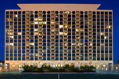 Artistic depiction of an apartment building at dusk in Chicago, IL