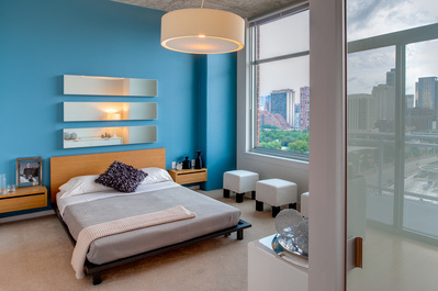 A contemporary bedroom in one of the luxurious apartments of the Roosevelt Collection in downtown Chicago, IL