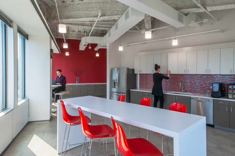 Employees in a common area of a corporate office 