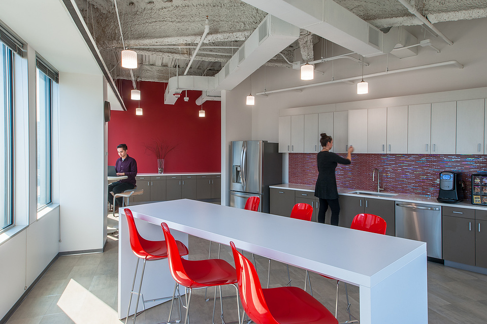 Employees in a common area of a corporate office 
