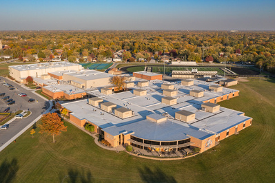The Oak Forest High School building complex from the air at sunset