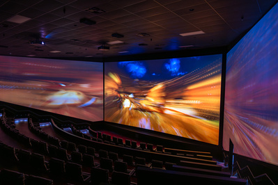 Striking view of a multi screen movie theater during play of a movie