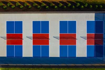 Bird eye view of four colorful pickle-ball courts 
