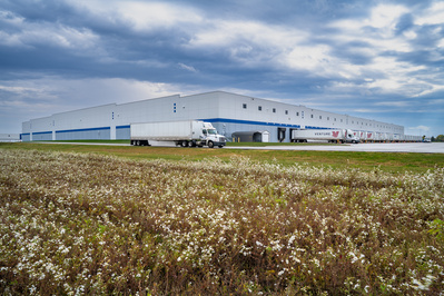 Semi trucks leaving a Toyota parts distribution warehouse in Lafayette, IN