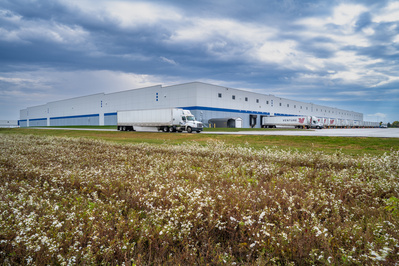 Semi trucks leaving a Toyota parts distribution warehouse in Lafayette, IN