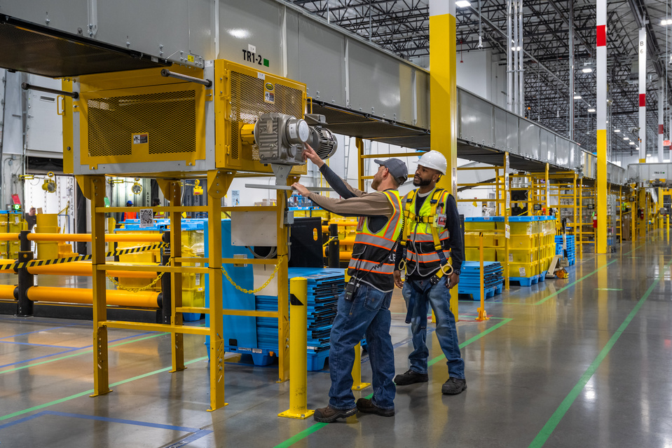 Supervisors overlooking the industrial process applications at a large logistics facility