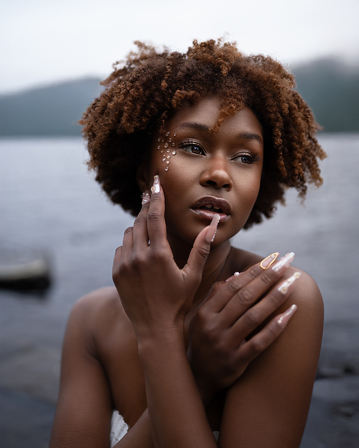 Black model posing for a beauty photoshoot inspired by the zodiac sign pisces