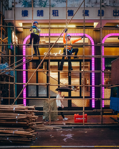 Construction workers tend to the bamboo scaffolding in Kowloon, Hong Kong.